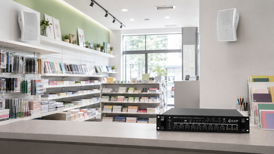 100V PA planning illustration with white wall-mounted speakers in a stationery shop